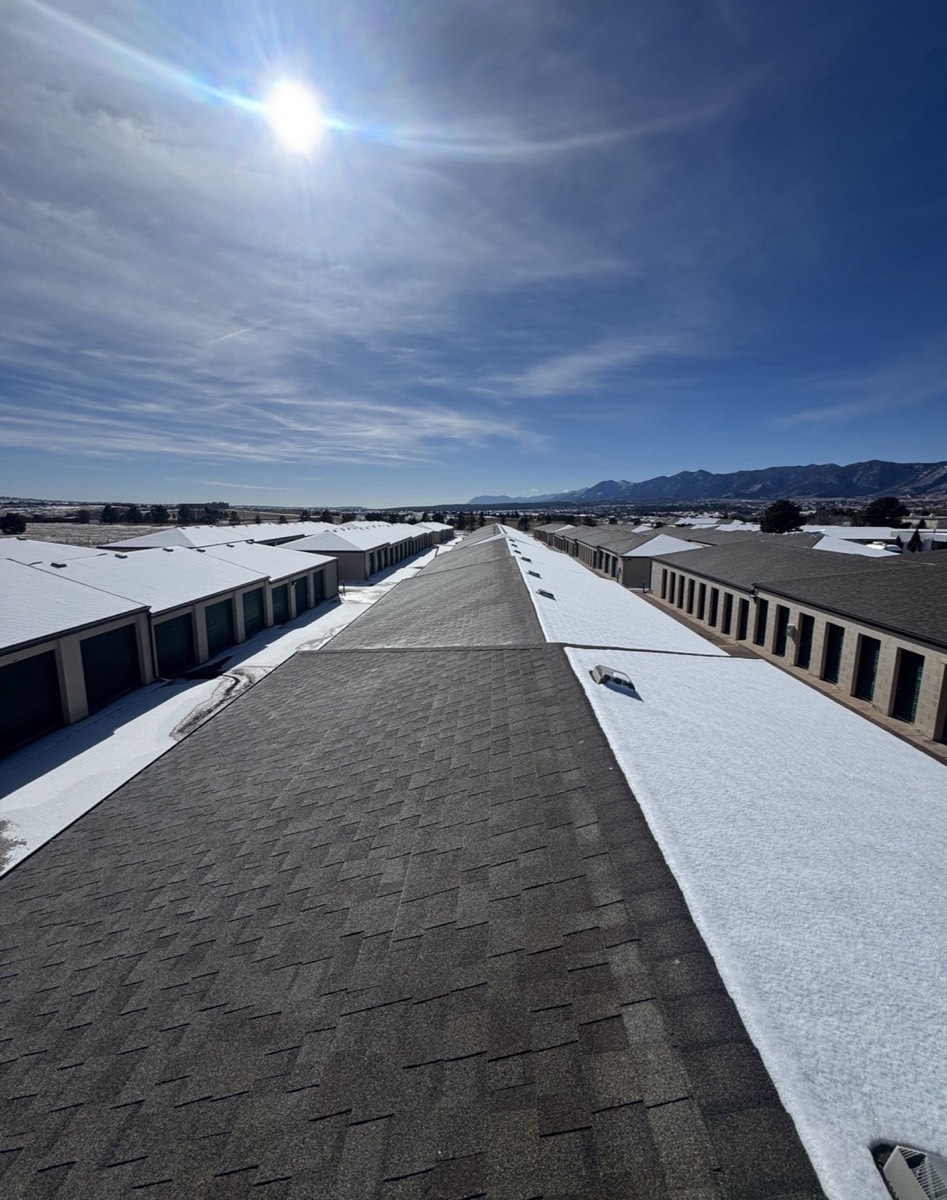 Finished commercial roof with the Rocky Mountains in the background
